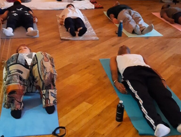 Corporate wellness session in London with team relaxation and sound bath